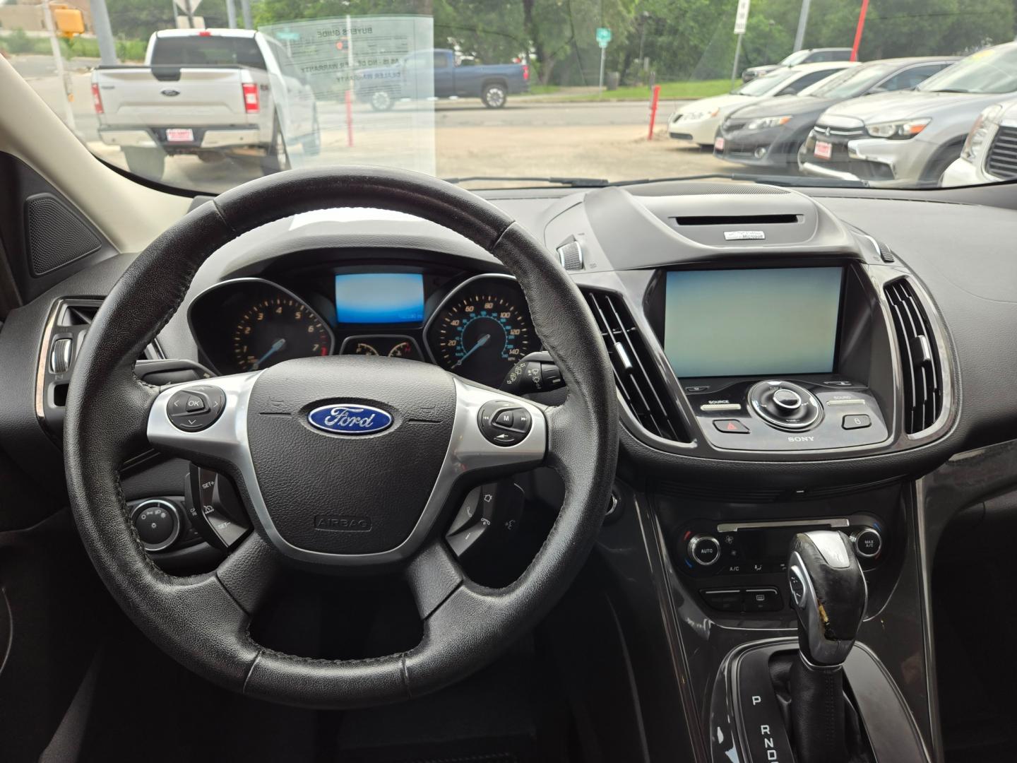 2014 Orange Ford Escape Titanium 4WD (1FMCU9JX7EU) with an 1.6L L4 DOHC 16V engine, 6-Speed Automatic transmission, located at 503 West Court, Seguin, TX, 78155, (830) 379-3373, 29.568621, -97.969803 - Photo#5